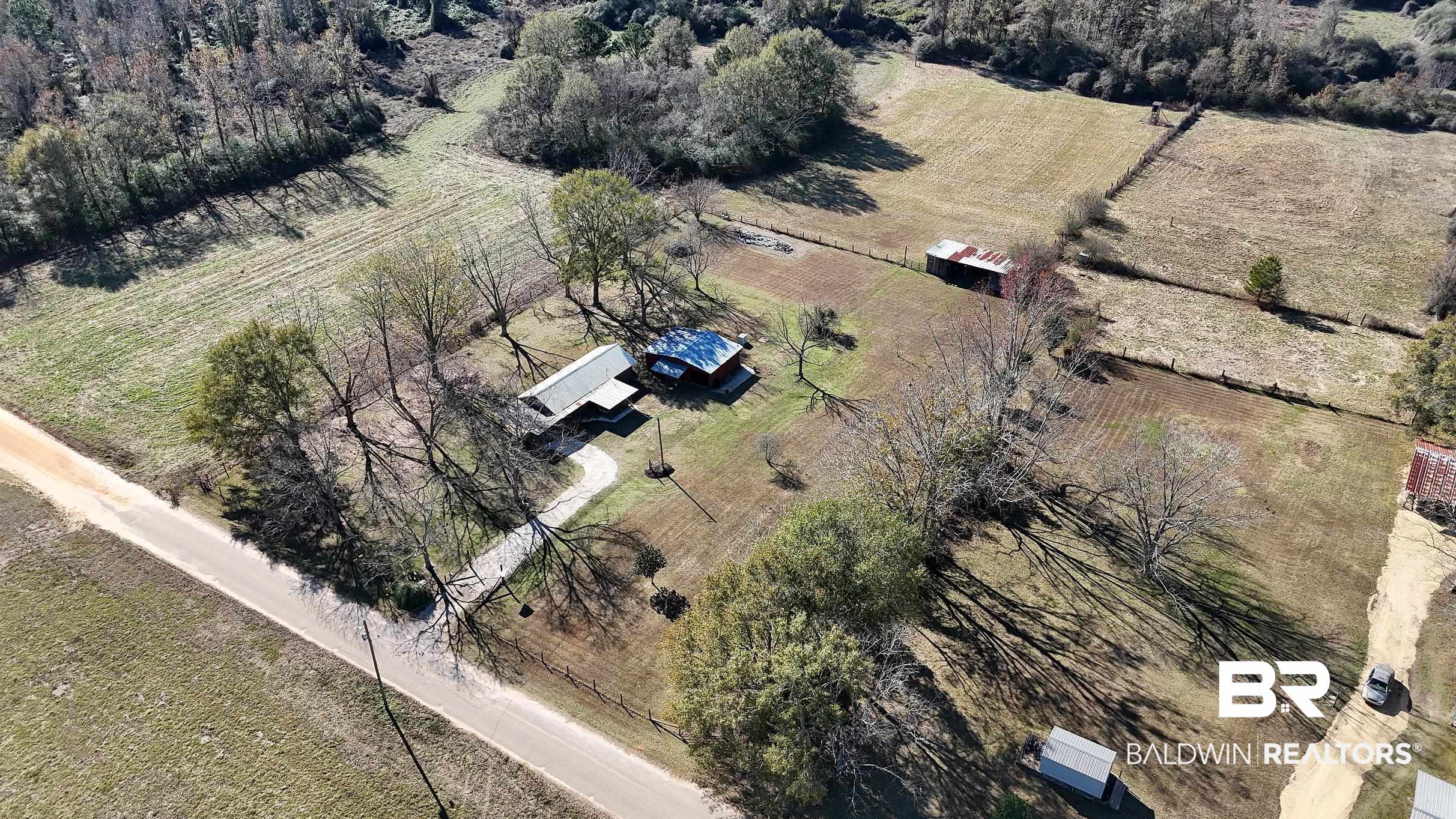 110 Sam Jones Road Atmore, AL 36502 - Photo 40 of 47 Aerial view of property and surrounding area with rural landscape