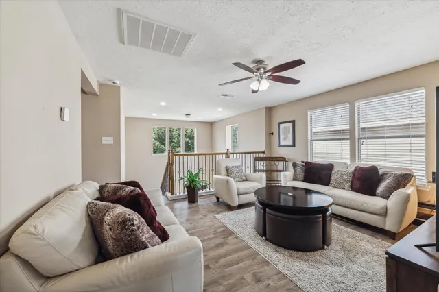 a living room with furniture and a large window