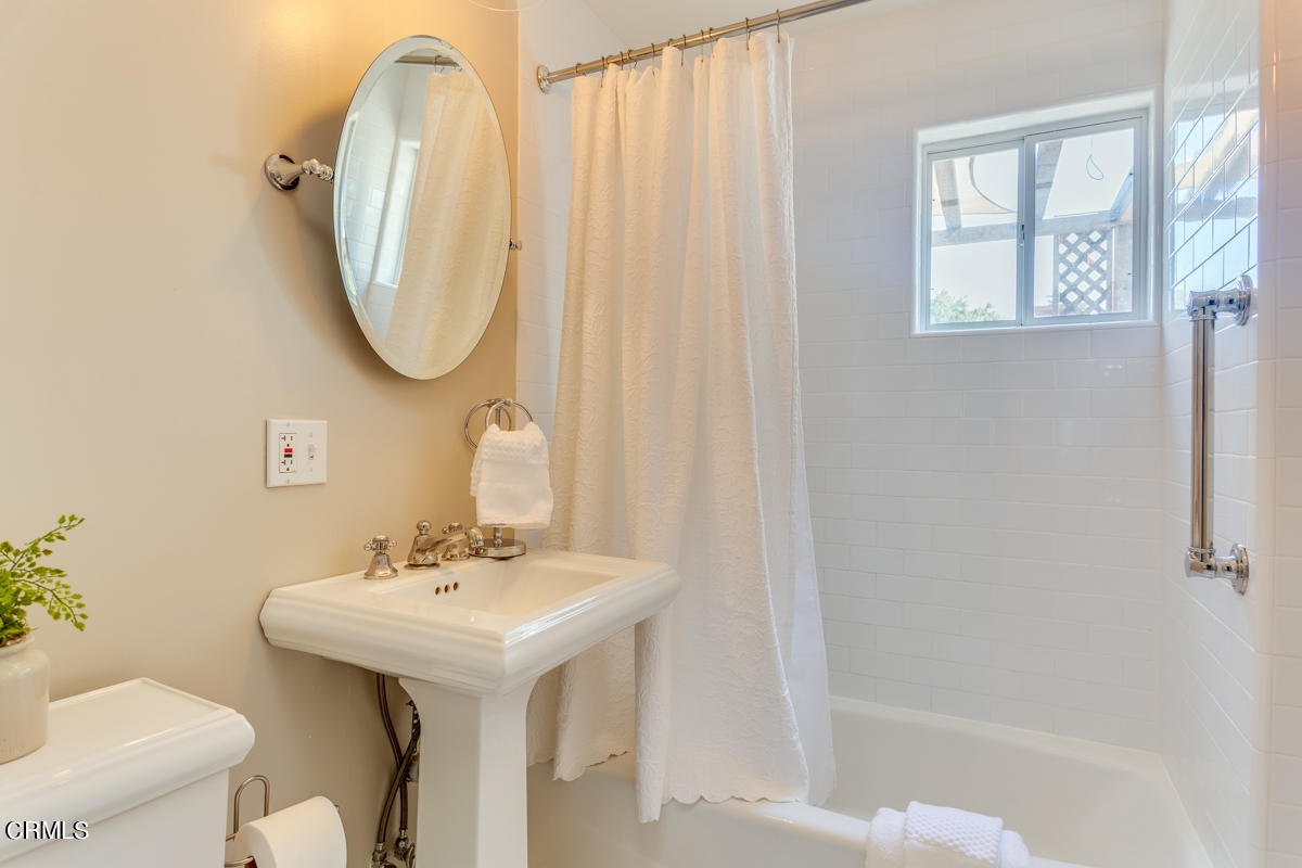 602 Atchison Street Pasadena, CA 91104 - Photo 17 of 34 a bathroom with a sink toilet and a mirror