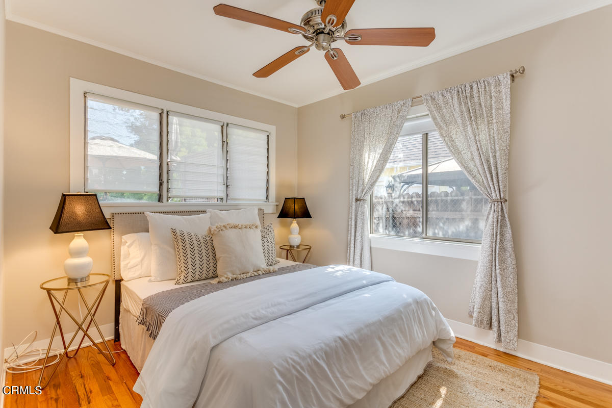 602 Atchison Street Pasadena, CA 91104 - Photo 18 of 34 a bedroom with a bed and a large window