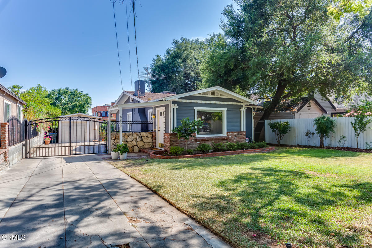 602 Atchison Street Pasadena, CA 91104 - Photo 2 of 34 a front view of a house with a garden and porch