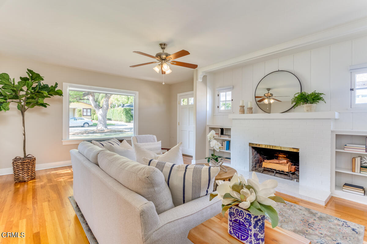 602 Atchison Street Pasadena, CA 91104 - Photo 10 of 34 a living room with furniture fireplace and a flat screen tv