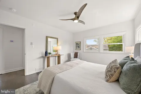 a bedroom with a large bed and a window