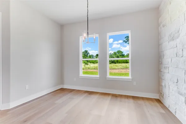 a kitchen with stainless steel appliances a sink a stove a refrigerator and cabinets