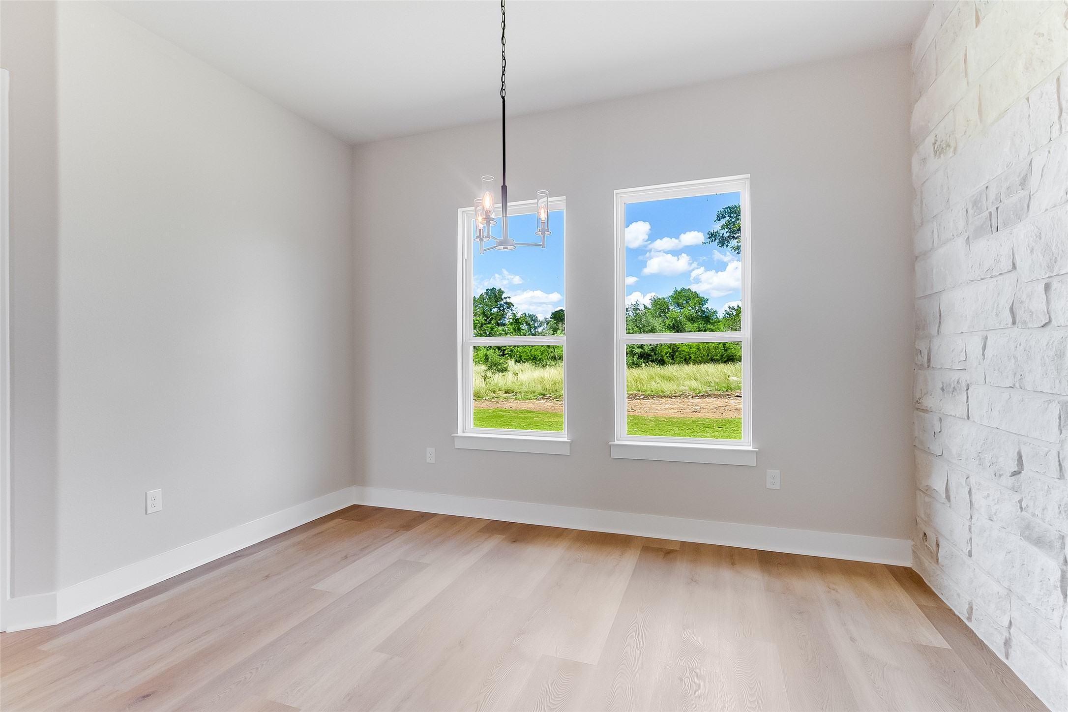130 Draper Lane Bertram, TX 78605 - Photo 17 of 31 a view of a room window and wooden floor