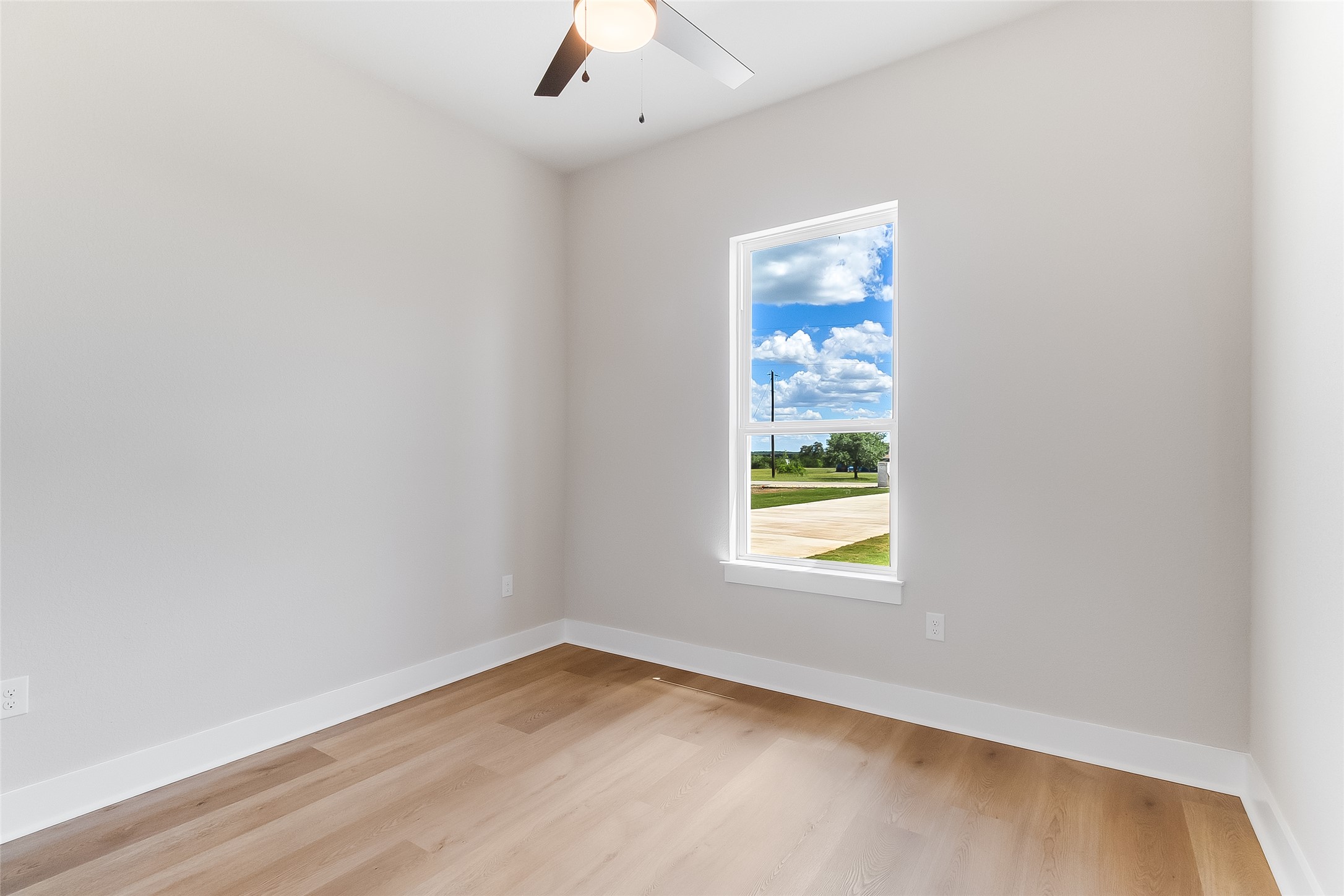 130 Draper Lane Bertram, TX 78605 - Photo 4 of 31 an empty room with a window