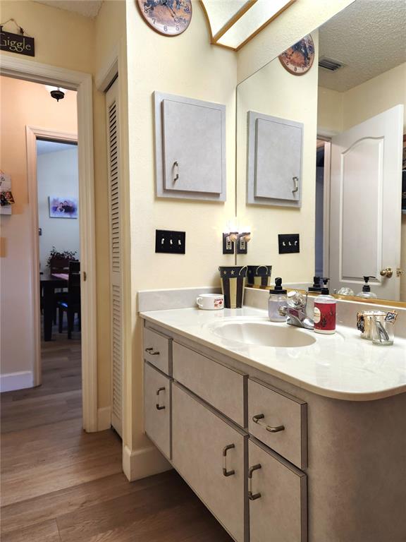 1701 Southeast 24th Road, Unit 1601 Ocala, FL 34471 - Photo 23 of 30 a bathroom with a sink and a mirror