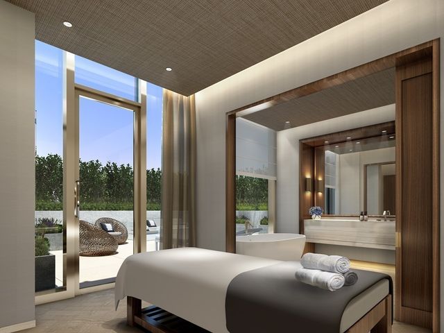 a bedroom with a large bed and a balcony