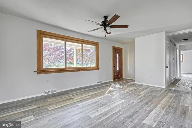 a view of an empty room with a window