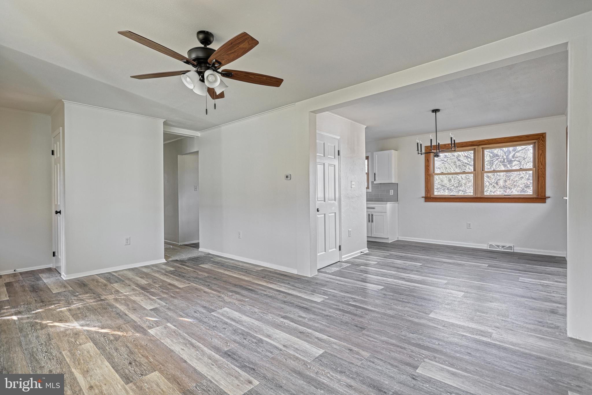 850 Jefferson Lane Red Lion, PA 17356 - Photo 13 of 82 a view of an empty room with window and wooden floor