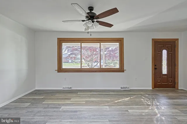 a view of an empty room with a window