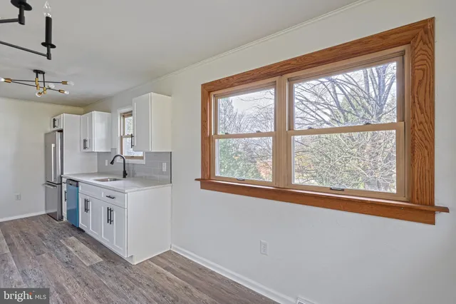 a kitchen with a sink and cabinets