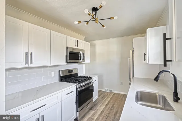 a bathroom with a toilet sink a shower and mirror