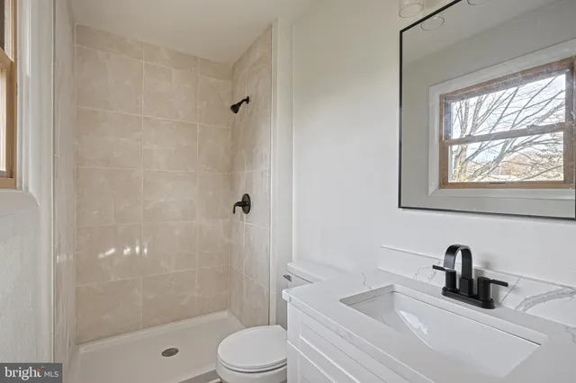 a living room with hard wood floors