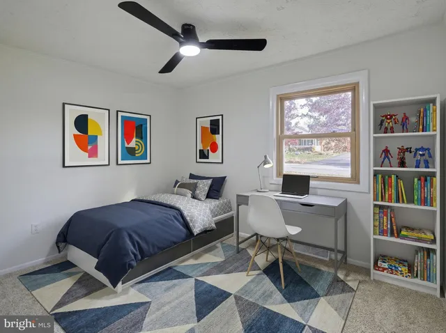 a view of a room with racks on the wall and a window