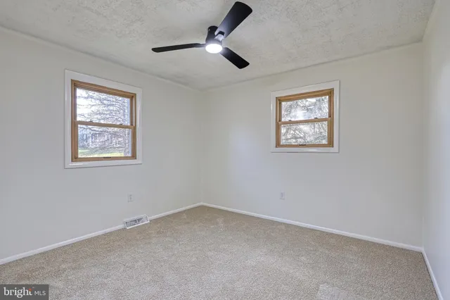 a view of a house with a yard and garage