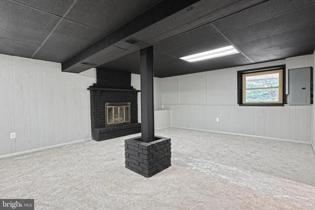 an aerial view of residential houses with outdoor space and seating