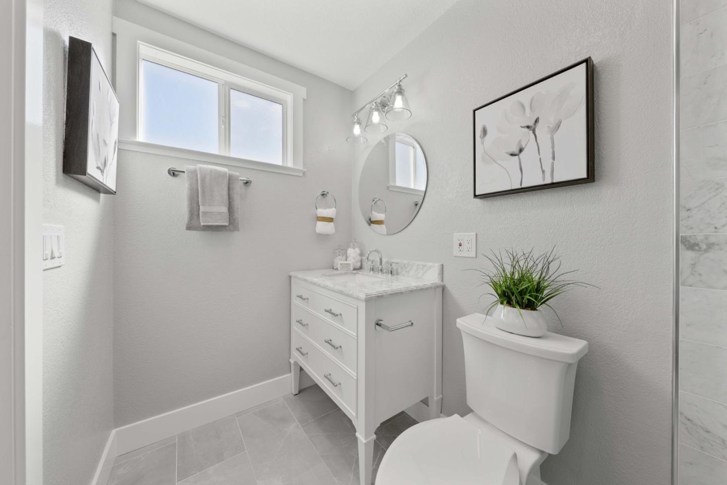 3905 Stanford Way Livermore, CA 94550 - Photo 13 of 32 a bathroom with a toilet sink and mirror