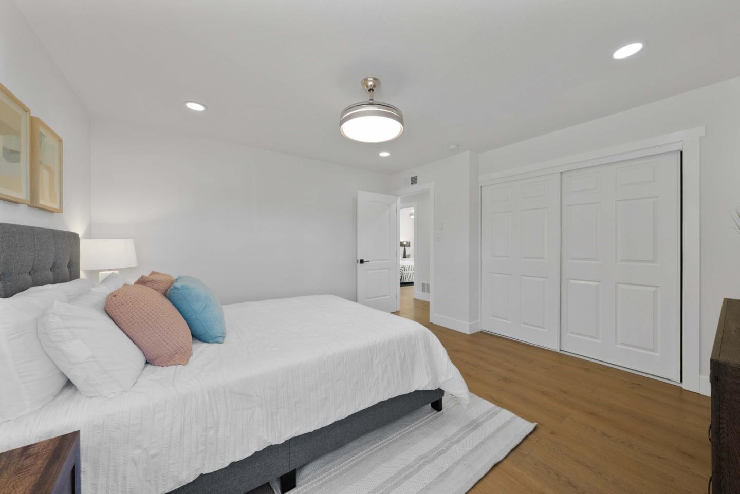 3905 Stanford Way Livermore, CA 94550 - Photo 15 of 32 a bedroom with a bed and a chandelier