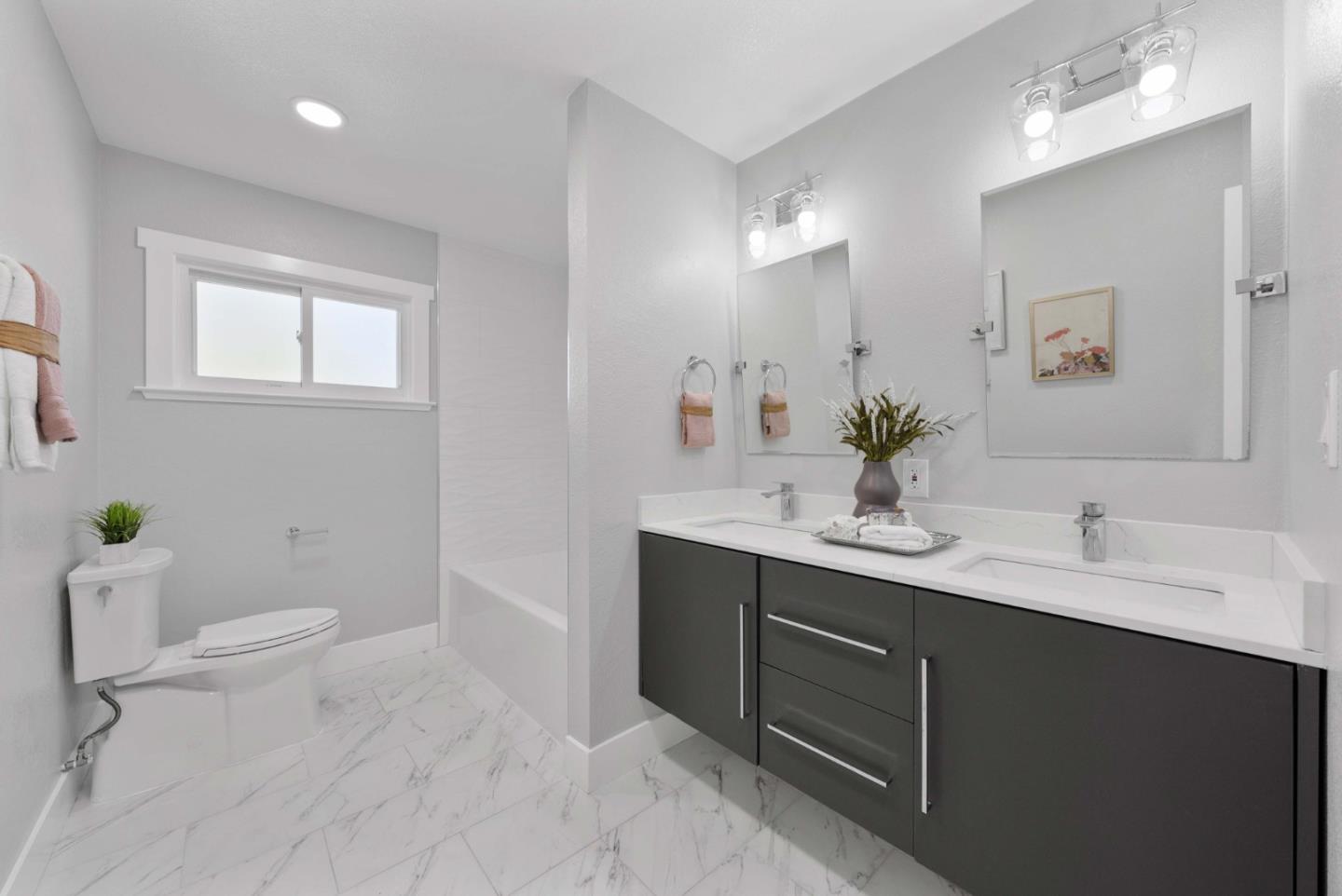 3905 Stanford Way Livermore, CA 94550 - Photo 21 of 32 a bathroom with a sink a toilet and a mirror
