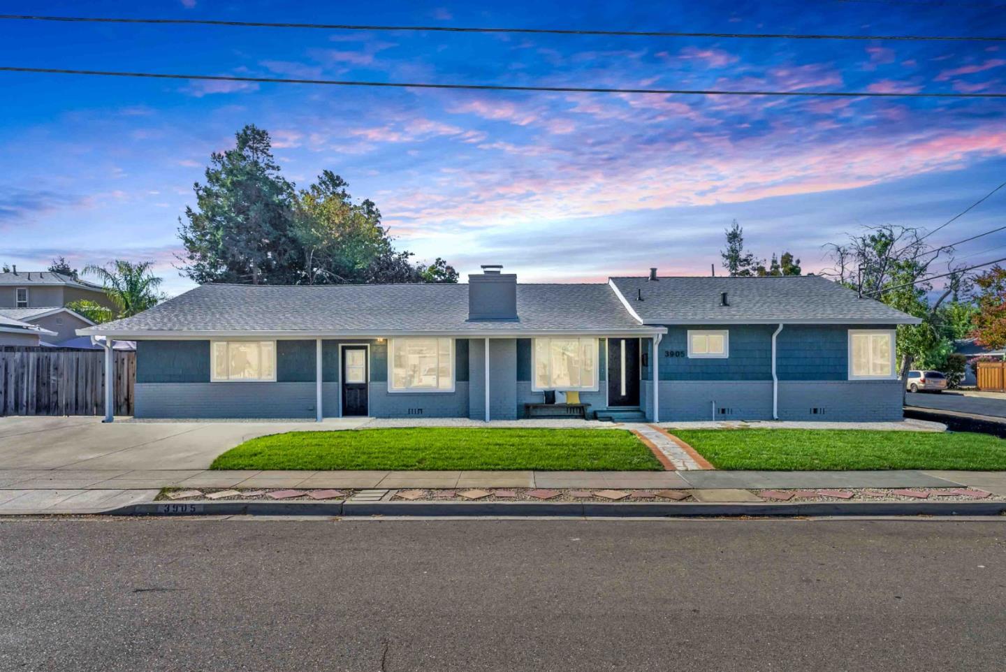 3905 Stanford Way Livermore, CA 94550 - Photo 28 of 32 a front view of a house with a yard and garage