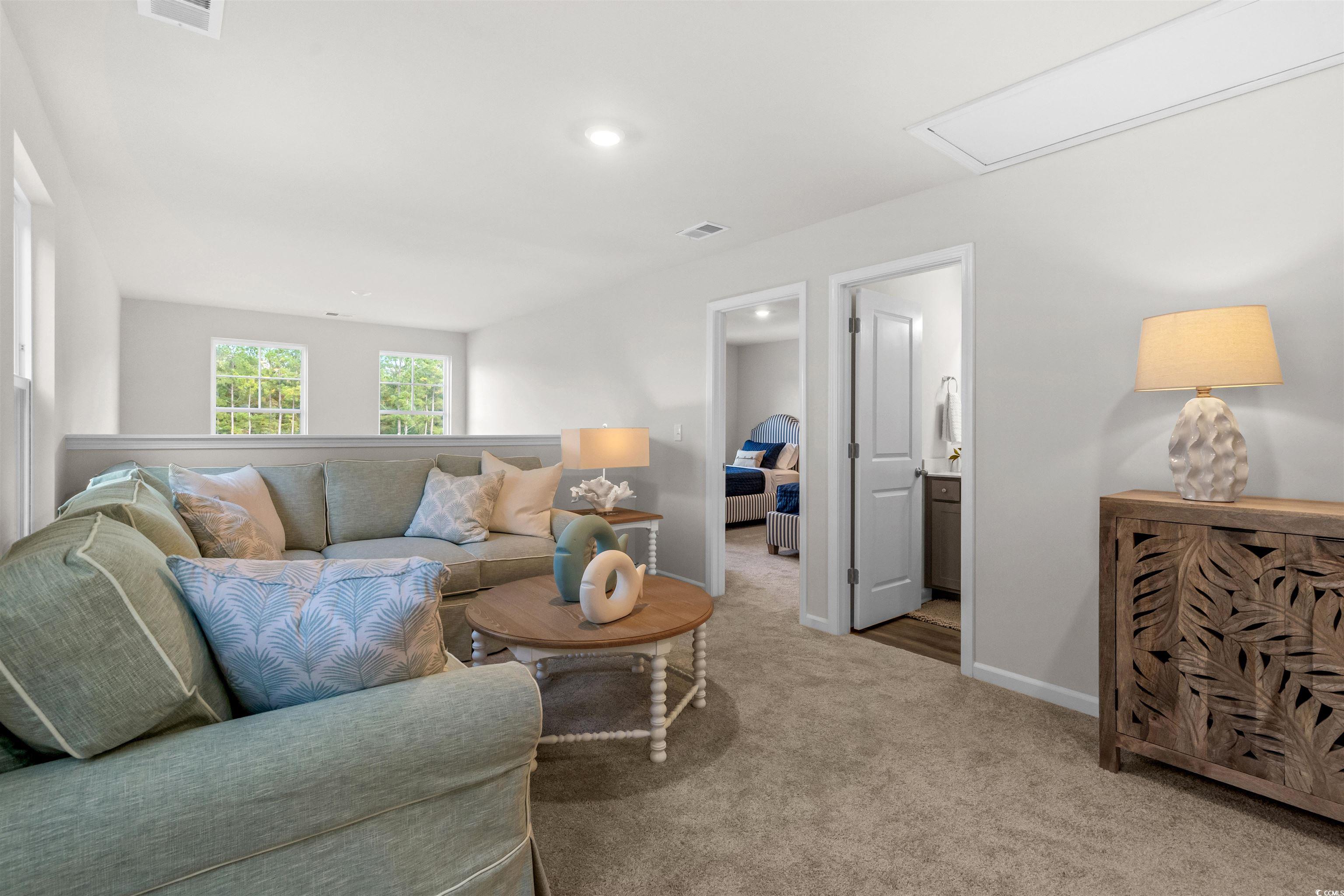 814 Palm Frond Way, Unit 42 Calabash, NC 28467 - Photo 22 of 31 Carpeted living area in loft