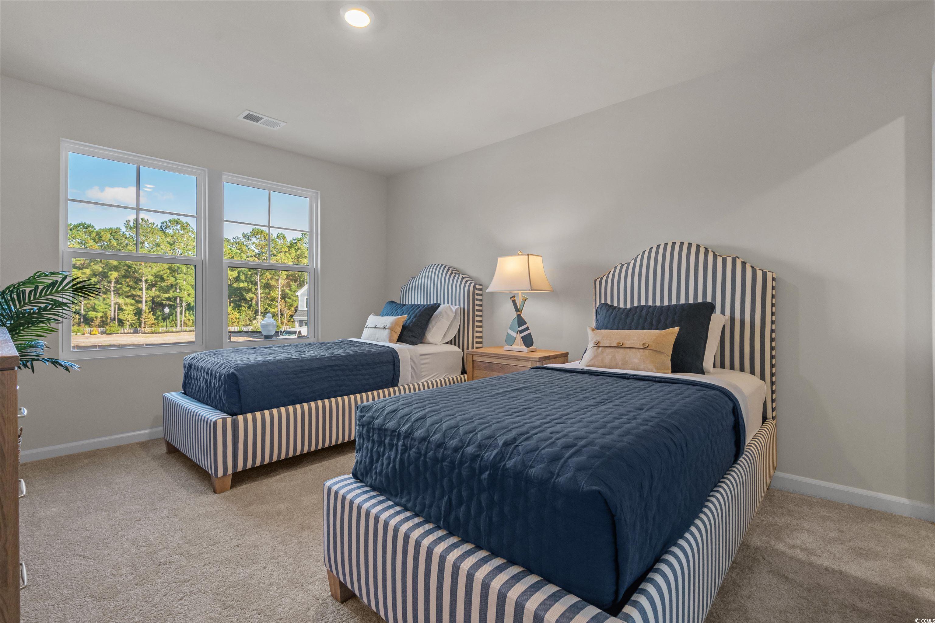 814 Palm Frond Way, Unit 42 Calabash, NC 28467 - Photo 28 of 31 Carpeted bedroom with spacious closet and recessed light, fan pre-wire