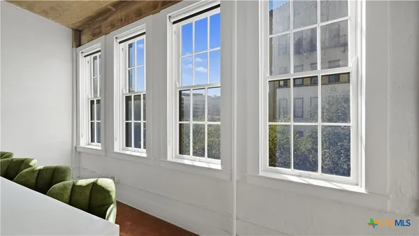 a living room with furniture and a window
