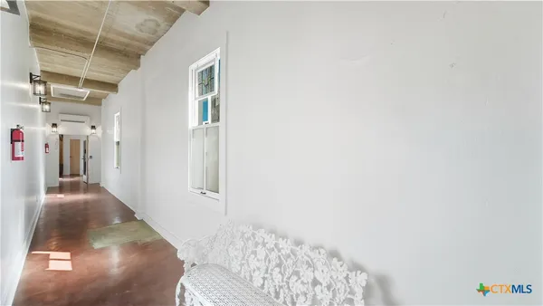 a view of a dining room with furniture and window