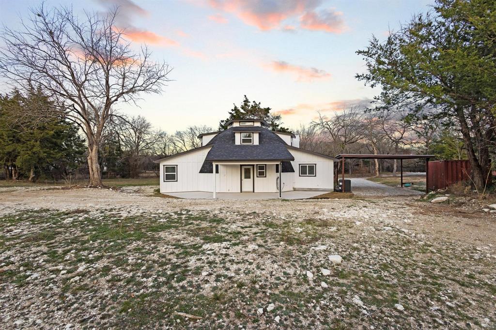 1325 Reynolds Road Whitewright, TX 75491 - Photo 29 of 39 a front view of a house with a yard