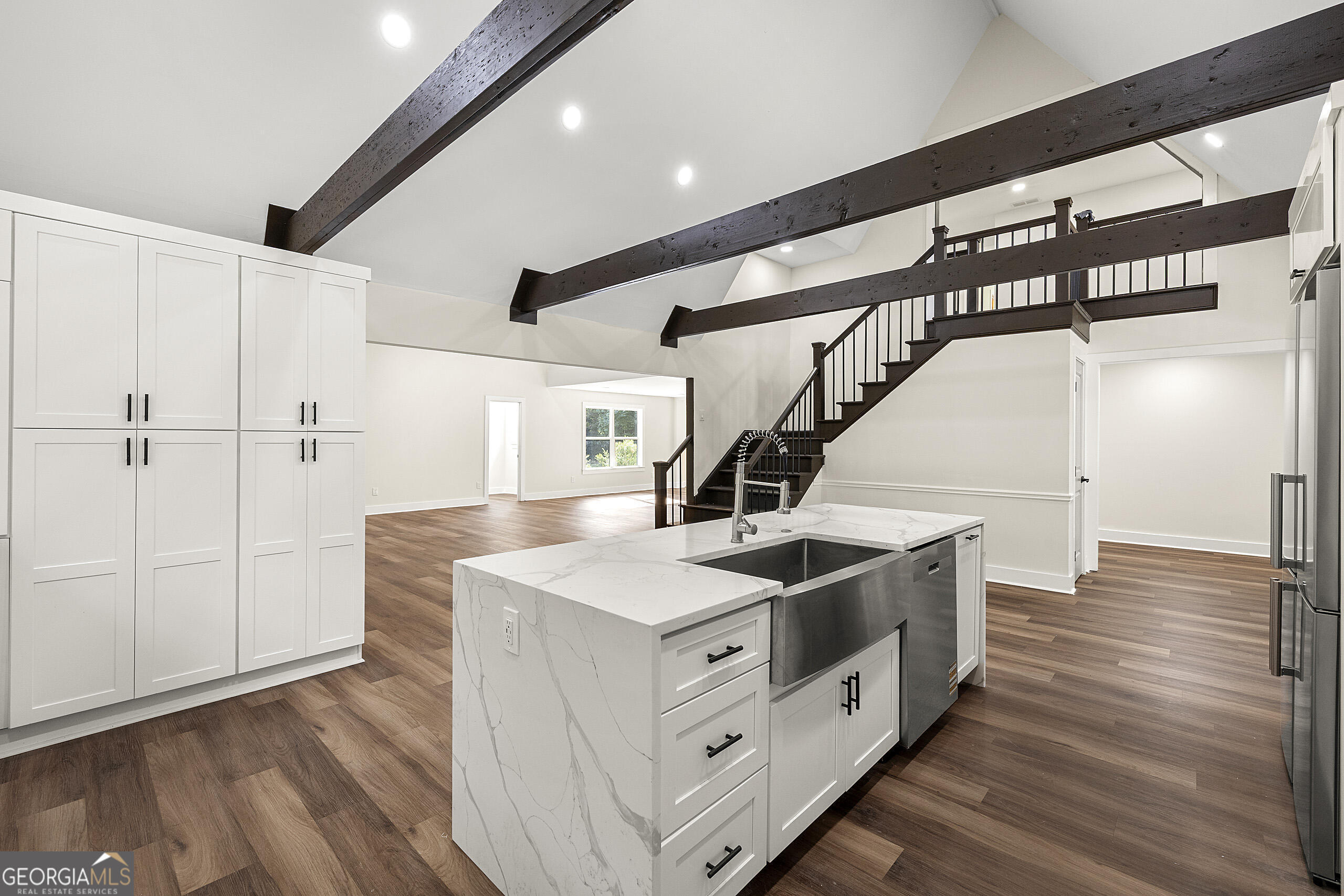 1620 Chevron Way Sandy Springs, GA 30350 - Photo 11 of 33 a kitchen with a sink and wooden floor