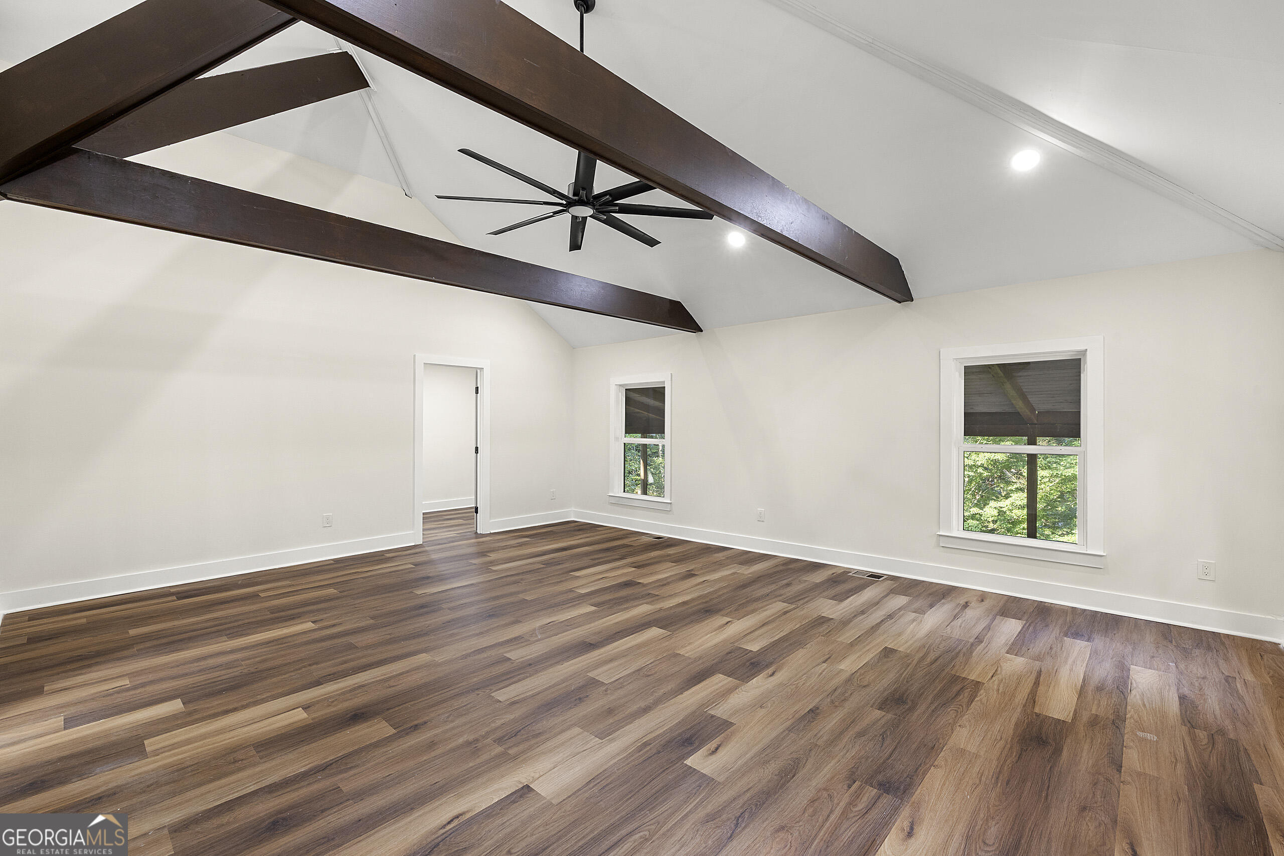1620 Chevron Way Sandy Springs, GA 30350 - Photo 14 of 33 a view of an empty room with wooden floor and a window