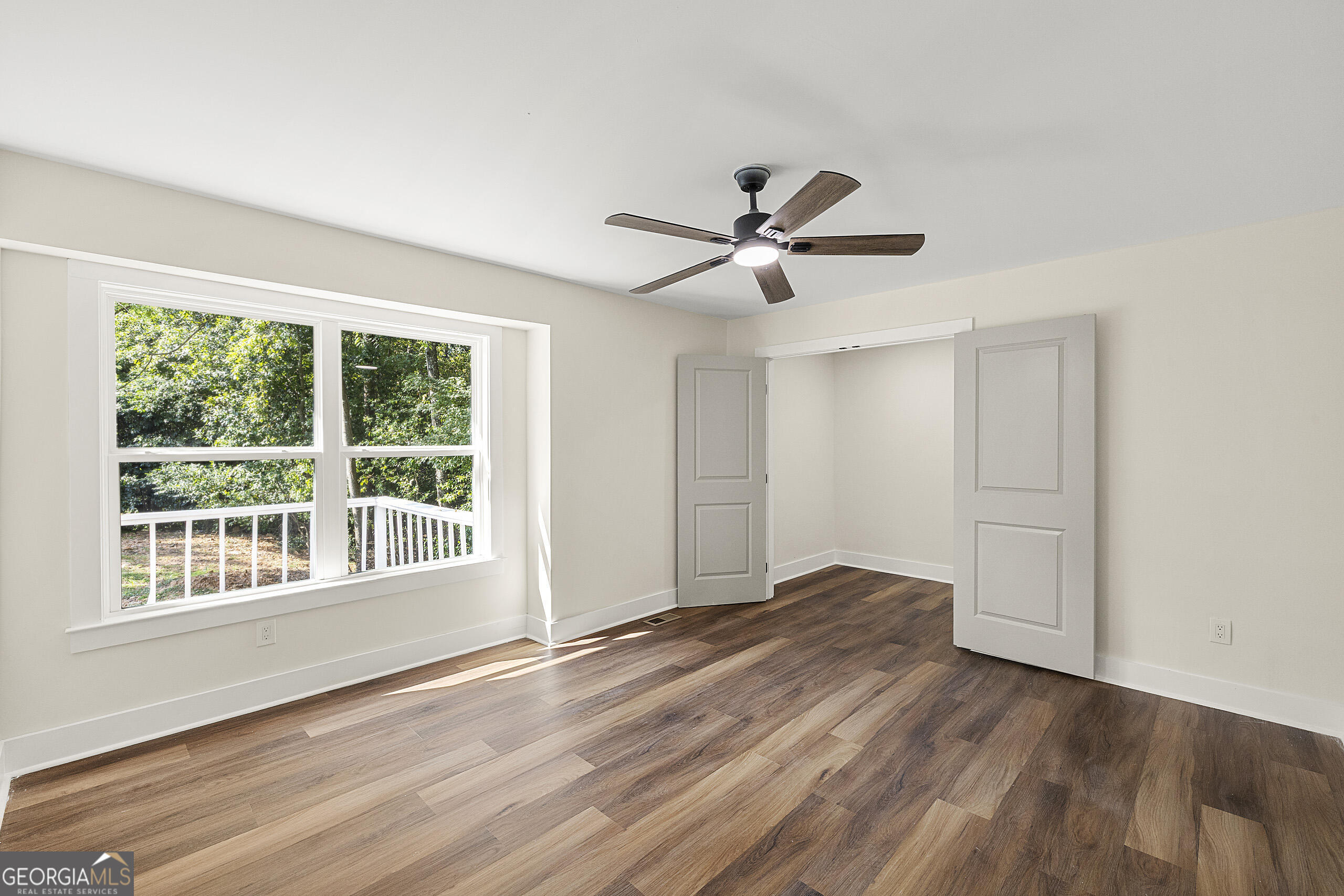 1620 Chevron Way Sandy Springs, GA 30350 - Photo 17 of 33 a view of a big room with wooden floor and windows