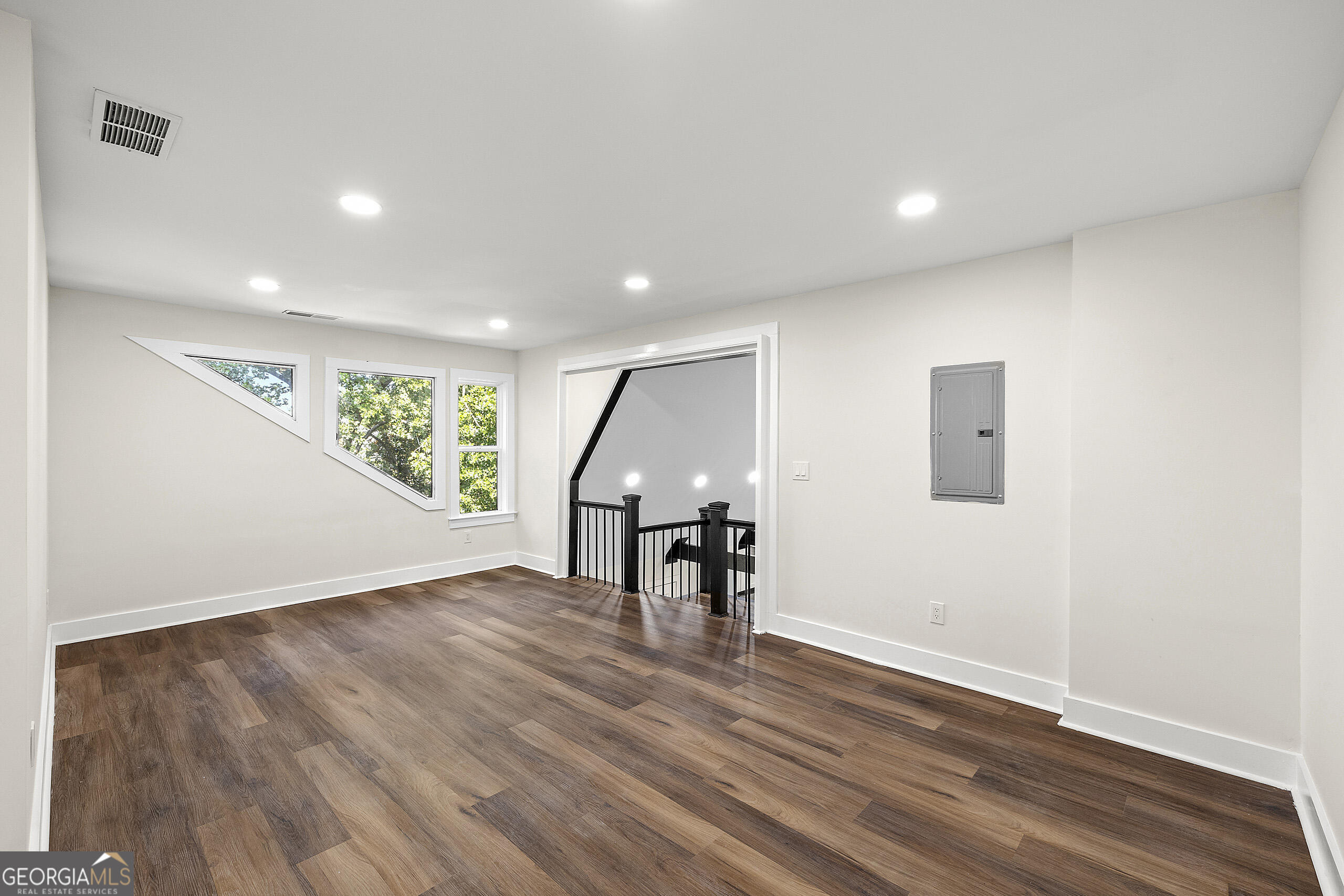 1620 Chevron Way Sandy Springs, GA 30350 - Photo 19 of 33 a view of an empty room with wooden floor and a window