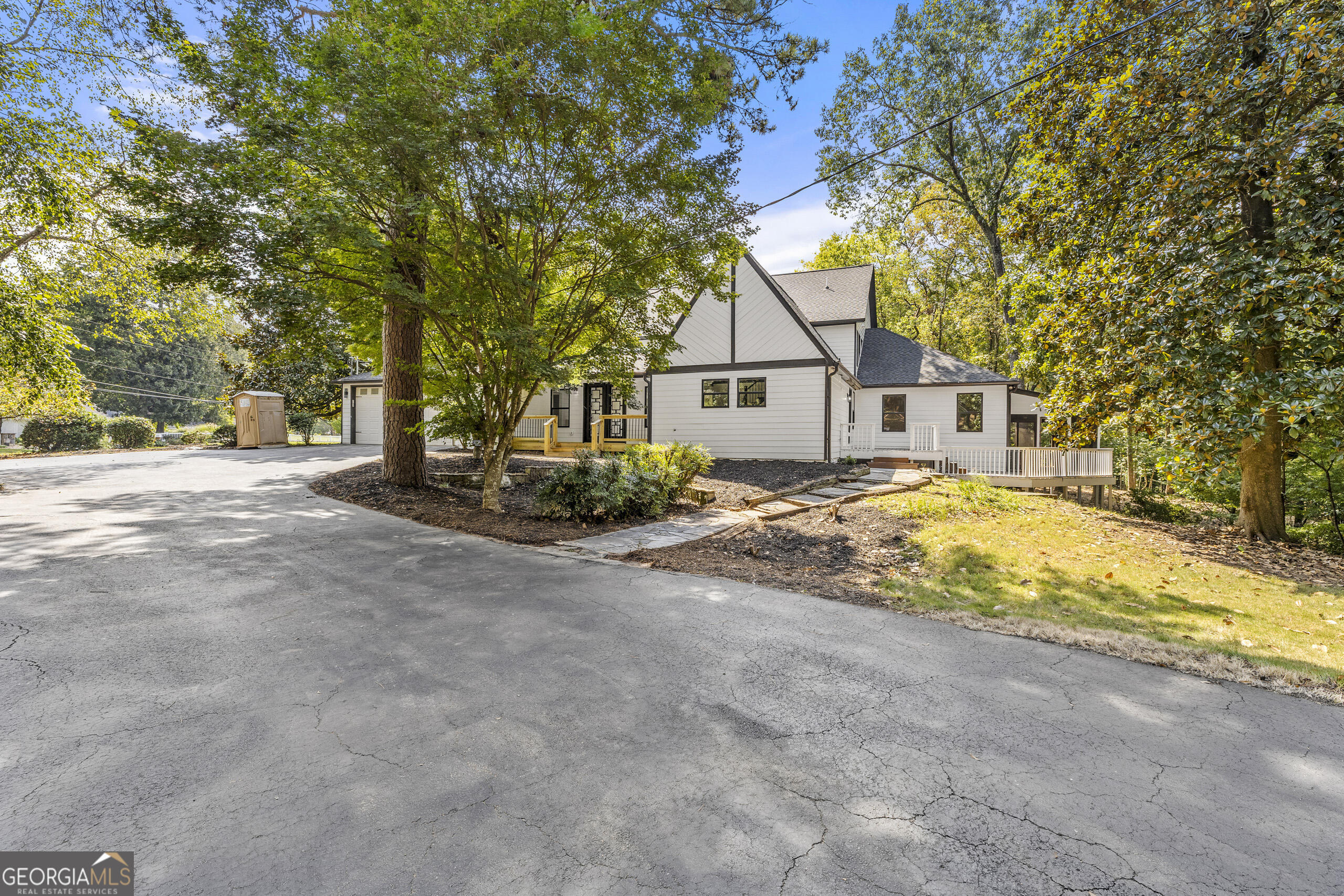 1620 Chevron Way Sandy Springs, GA 30350 - Photo 2 of 33 a house with trees in front of it