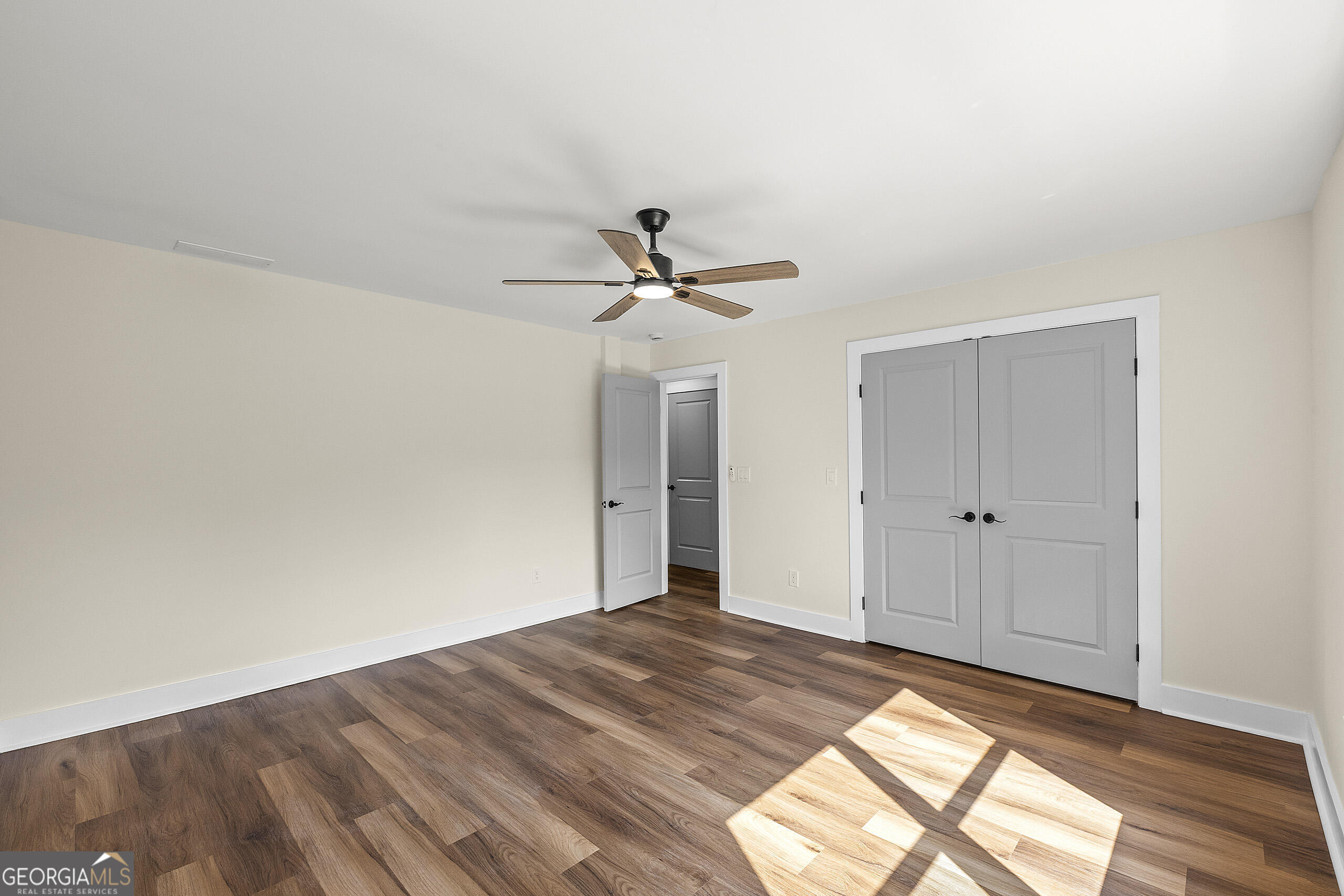 1620 Chevron Way Sandy Springs, GA 30350 - Photo 21 of 33 a view of a livingroom with a ceiling fan and wooden floor