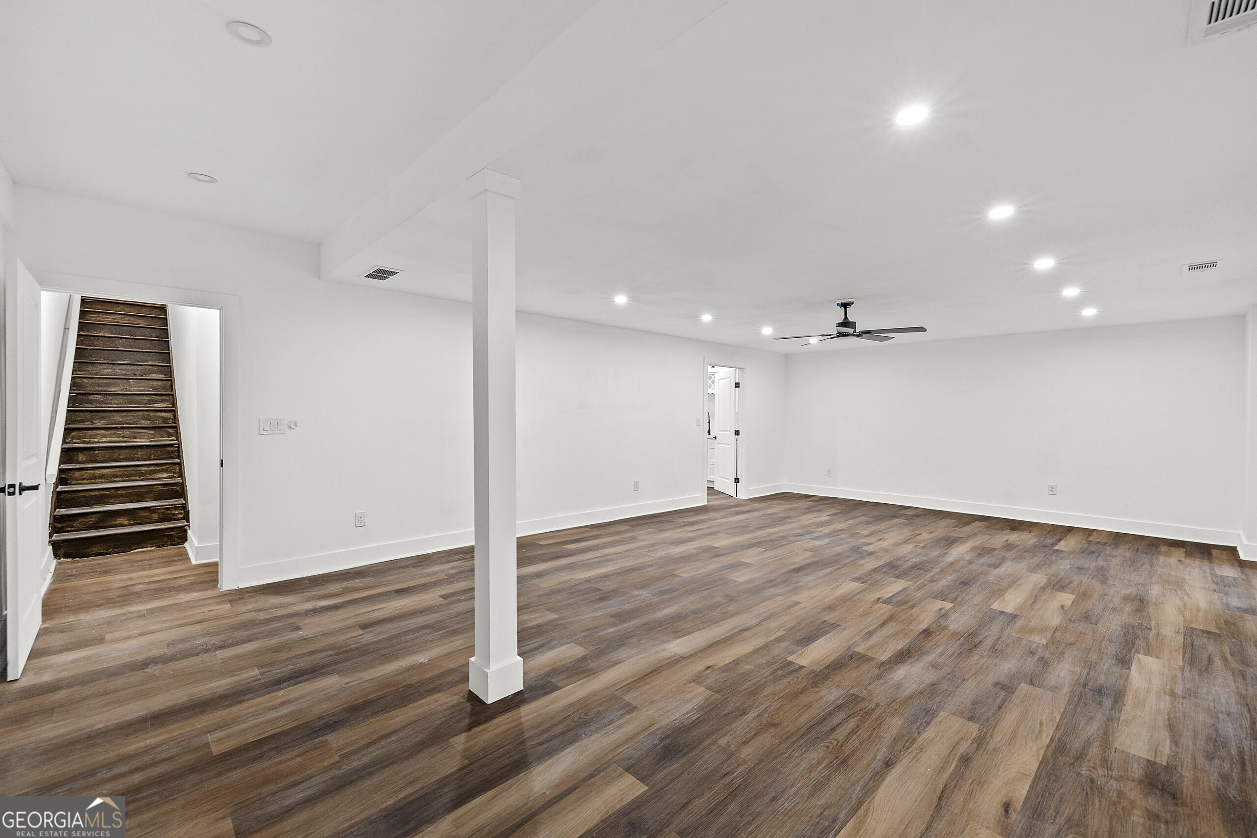 1620 Chevron Way Sandy Springs, GA 30350 - Photo 27 of 33 an empty room with wooden floor and entryway