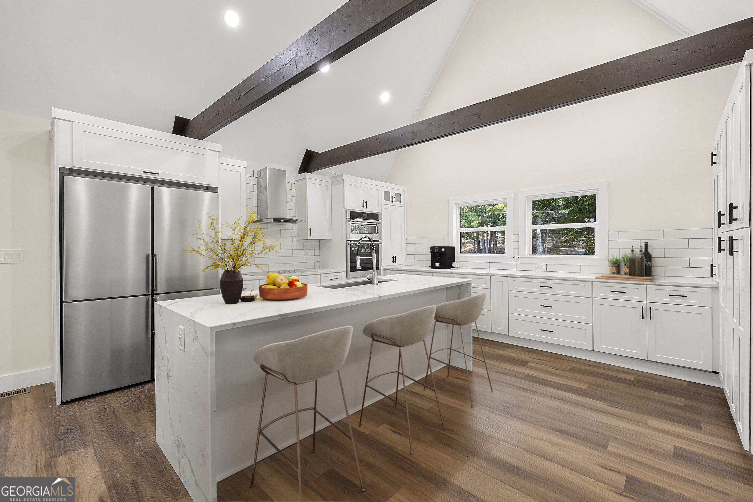 1620 Chevron Way Sandy Springs, GA 30350 - Photo 4 of 33 a kitchen with white cabinets and white appliances