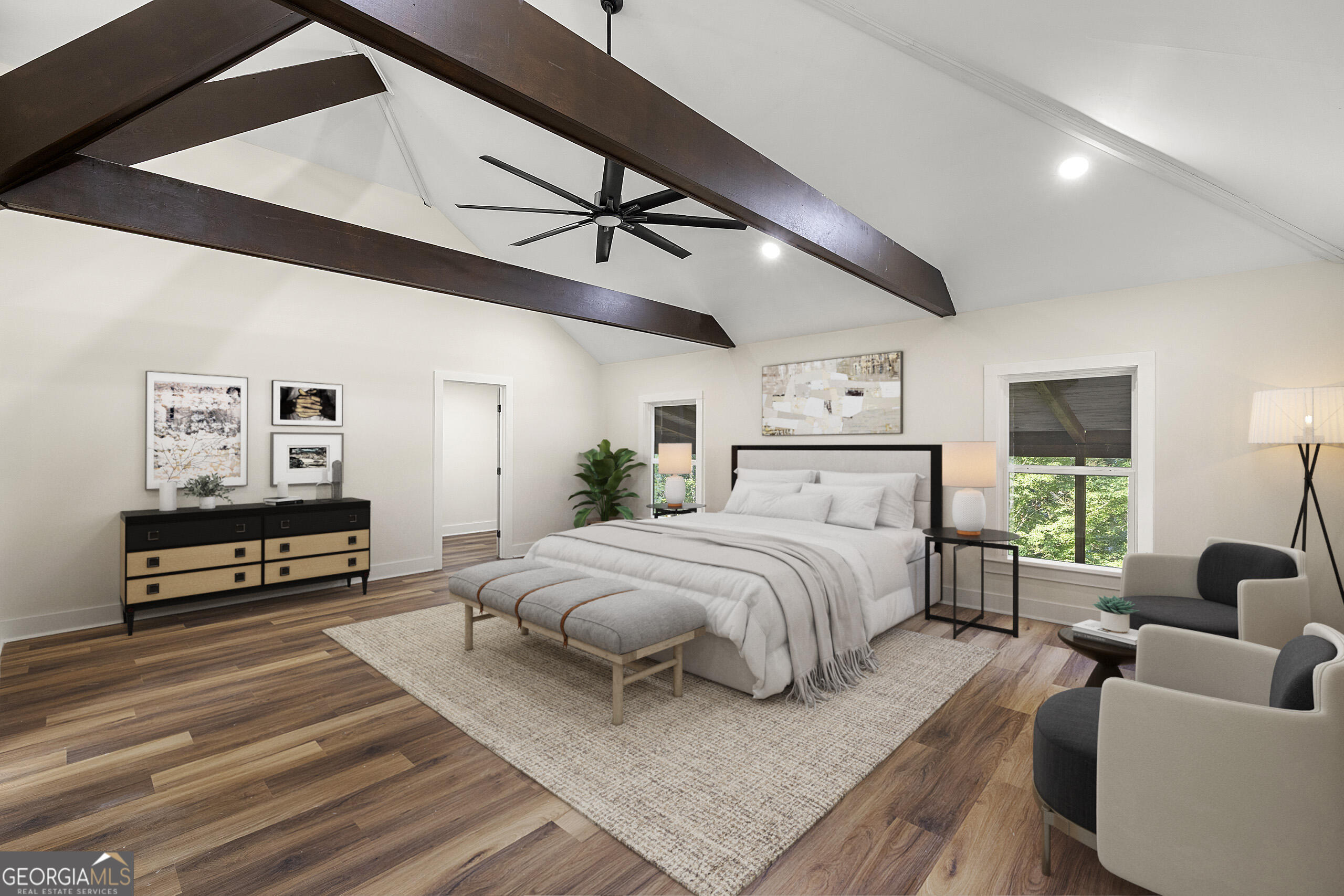 1620 Chevron Way Sandy Springs, GA 30350 - Photo 6 of 33 a spacious bedroom with a bed a couch and a flat tv screen on the dresser