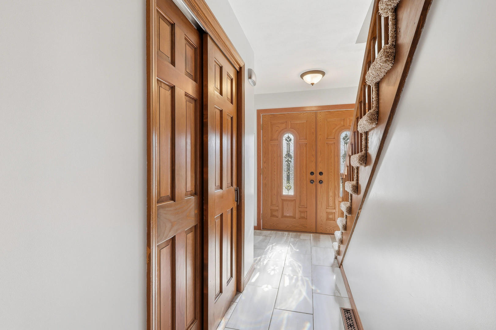 4314 Spring Street Davenport, IA 52807 - Photo 25 of 51 a view of a hallway with wooden floor and staircase