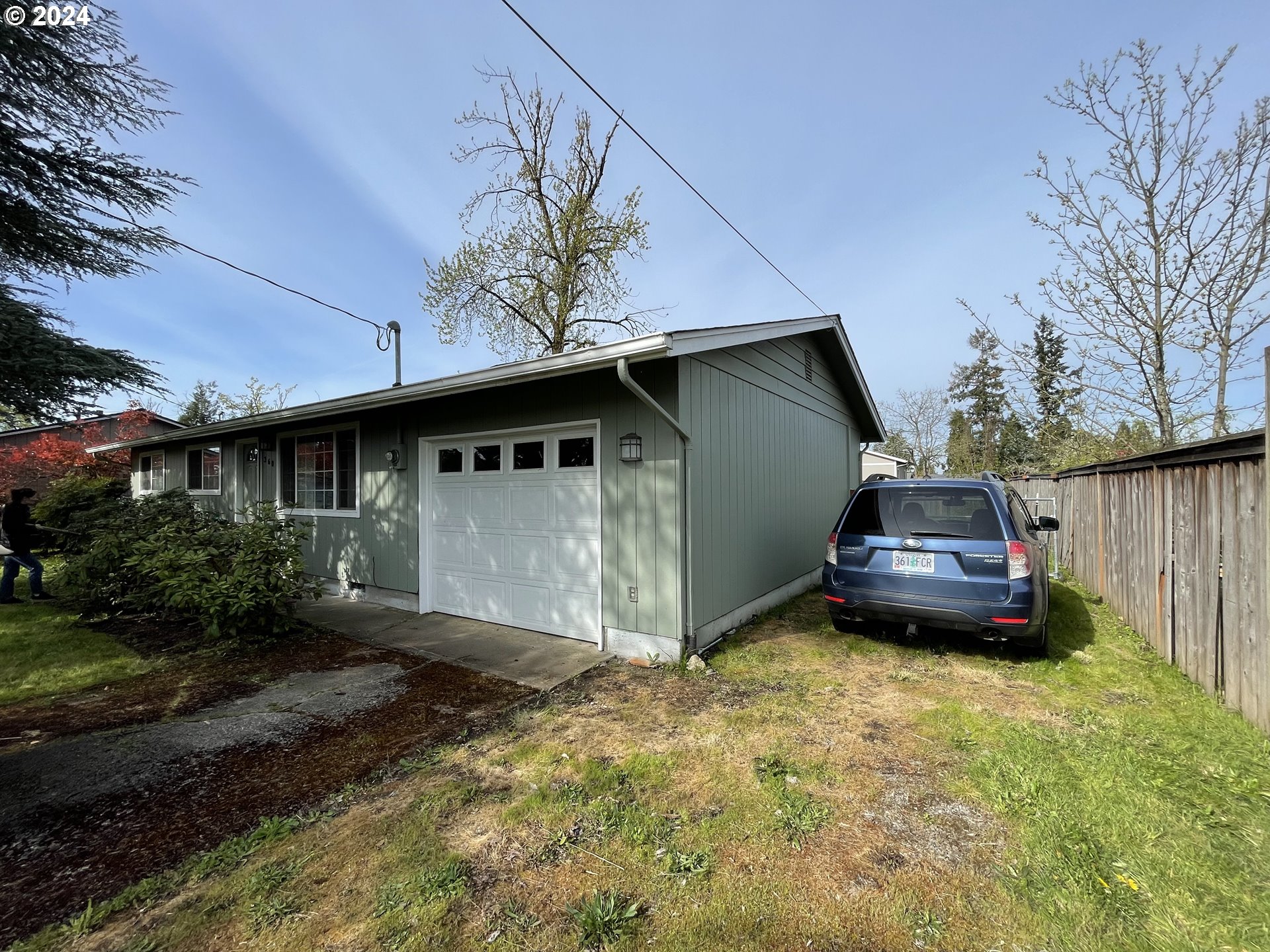 360 South 46th Street Springfield, OR 97478 - Photo 3 of 23 a front view of a house with a garden