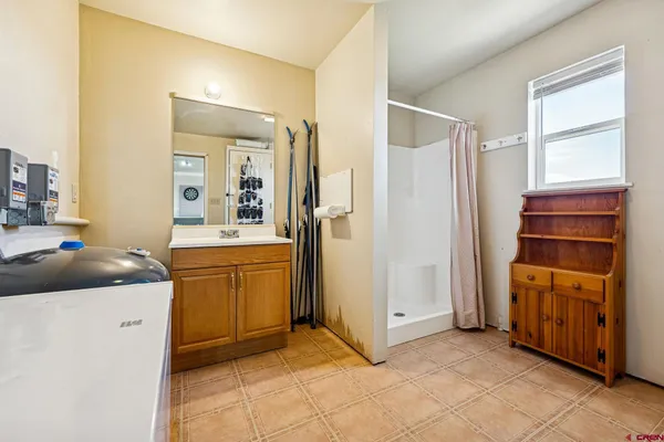 a kitchen with a refrigerator and sink