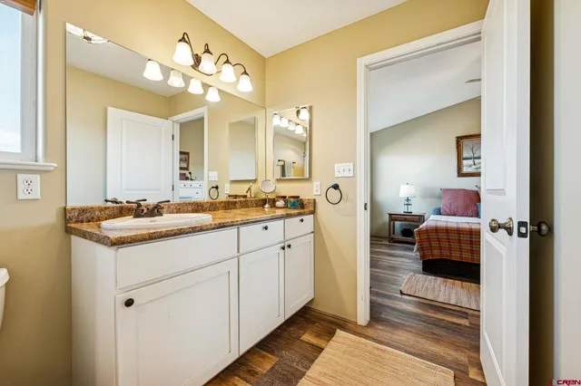 a bathroom with a sink double vanity and a mirror