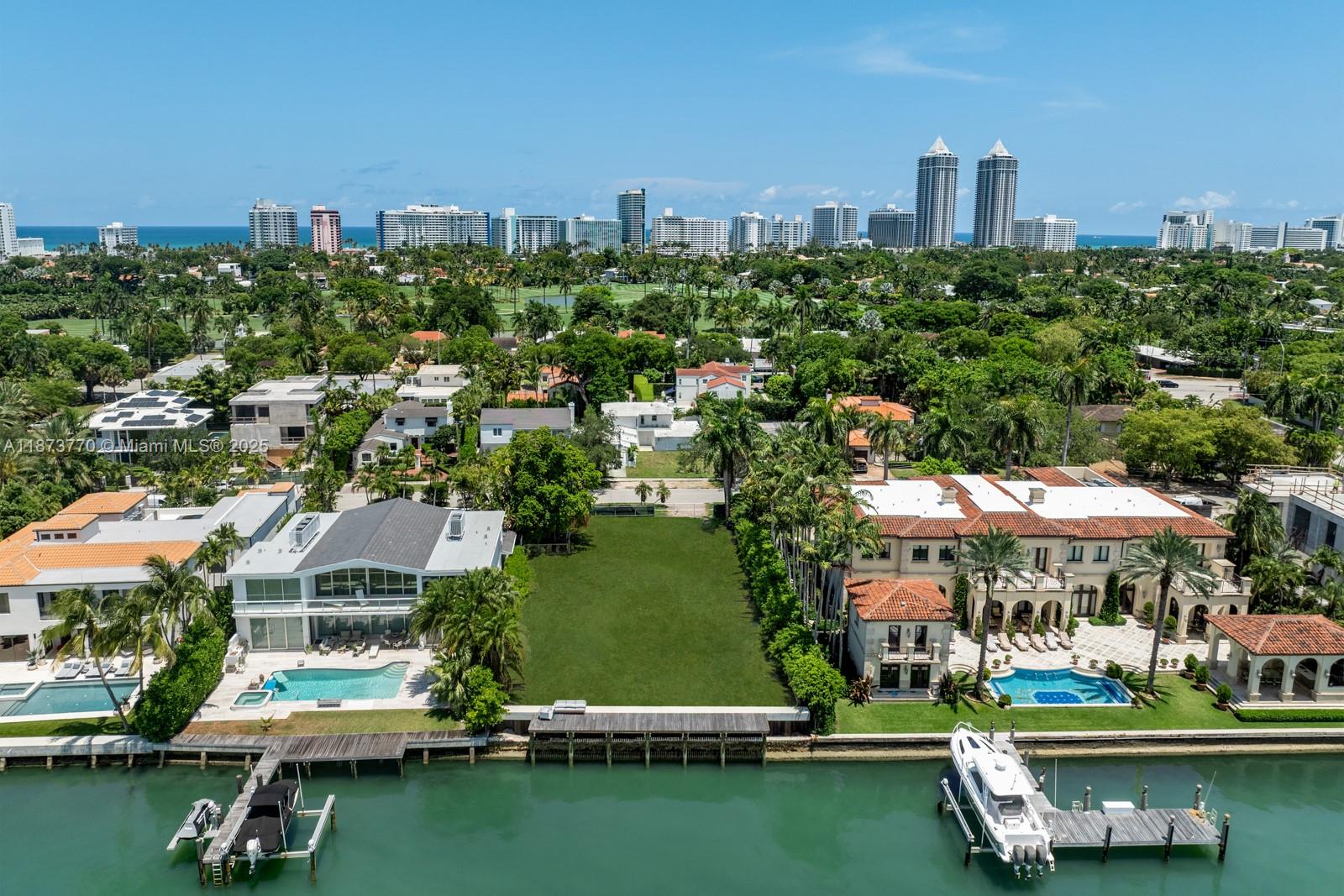 5226 North Bay Road Miami Beach, FL 33140 - Photo 11 of 13 an aerial view of a city with lots of residential buildings and lake view in back