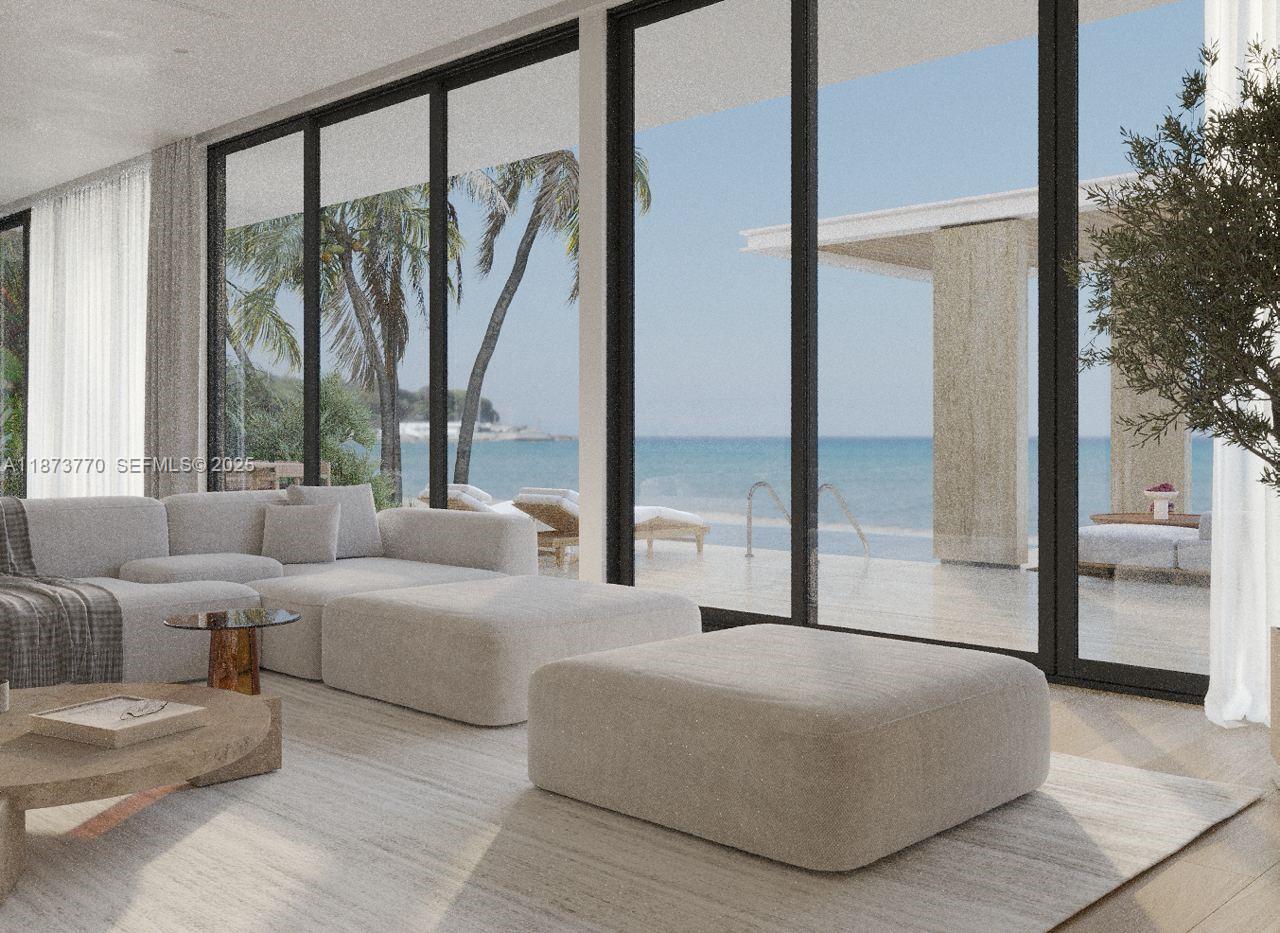 5226 North Bay Road Miami Beach, FL 33140 - Photo 5 of 13 a living room with furniture and a large window