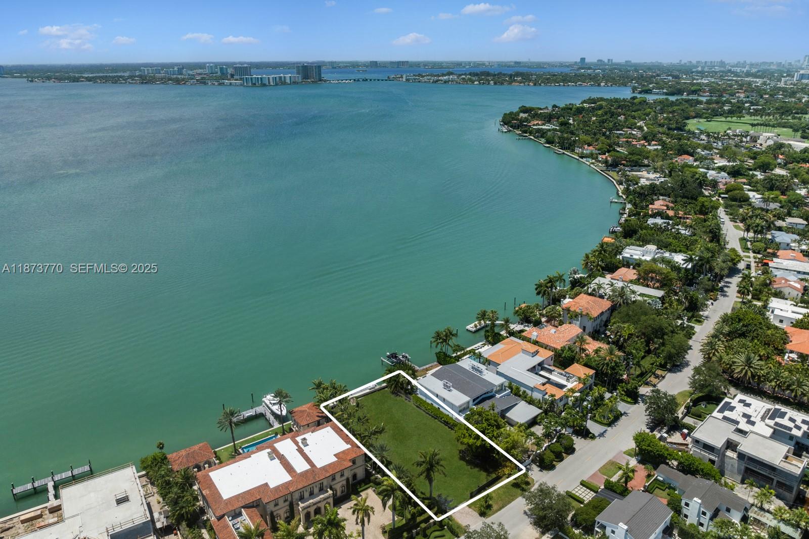 5226 North Bay Road Miami Beach, FL 33140 - Photo 7 of 13 an aerial view of a house with a lake view