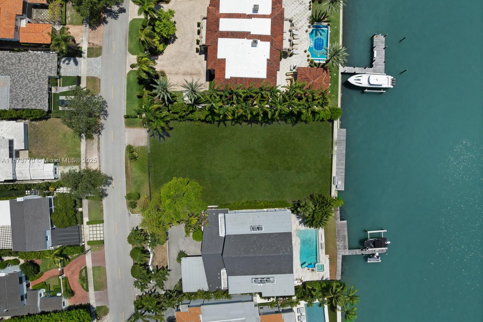 5226 North Bay Road Miami Beach, FL 33140 - Photo 10 of 13 an aerial view of a house with a garden and yard