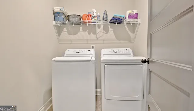 a utility room with dryer and washer