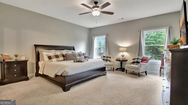 a spacious bedroom with a bed and window