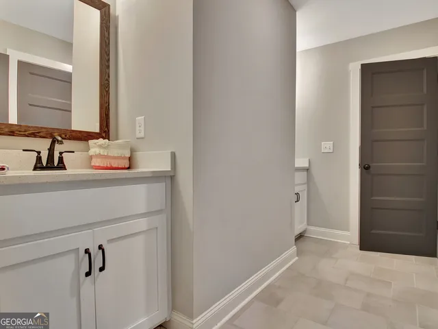 a view of a hallway with dining room and stairs